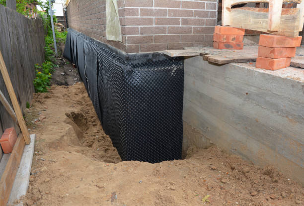 Happy homeowners after waterproofing job in Westmont